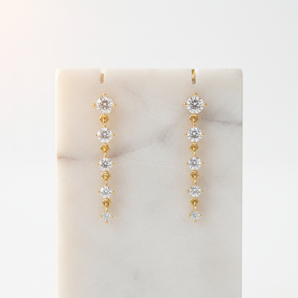 Boucles d'oreilles or sur support bijoux